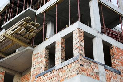 Repair of a building to complete the foundation and repair any damage.